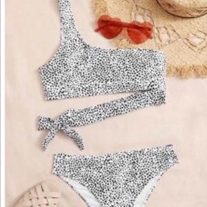 Two piece bathing suite. One shoulder.